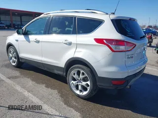2013 Ford Escape Titanium with VIN 1FMCU0J96DUA71857, listed as a IAAI auction lot 41877003 with 118,864 mi miles and . Bid and sale history available at carsss.com. Image 3.