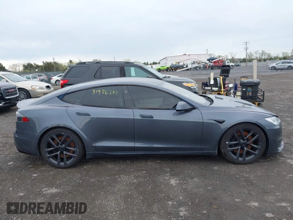 2021 Tesla Model S Long Range with VIN 5YJSA1E5XMF428519, listed as a IAAI auction lot 41926242 with 54,284 mi miles and . Bid and sale history available at DreamBid. Image 13.