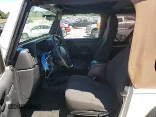 2004 Jeep Wrangler Sport with VIN 1J4FA49S94P751849, listed as a Copart auction lot 55519445 with 139,854 mi miles and Salvage title. Bid and sale history available at DreamBid. Image 7.