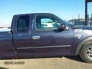 1999 Ford F-150 XL with VIN 1FTRX17L4XKA58054, listed as a IAAI auction lot 41647530 with 225,632 mi miles. Bid and sale history available at carsss.com. Image 13.