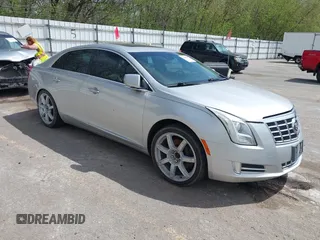 2013 Cadillac XTS Luxury z VIN 2G61P5S3XD9178601, wystawiony jako IAAI lot #42154859 z przebiegiem 111 227 mil mil oraz . Historia ofert i sprzedaży dostępna na DreamBid. Obrazek 1.