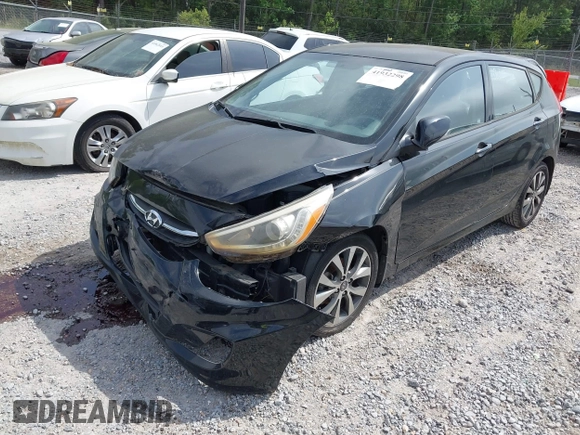 2015 Hyundai Accent Sport with VIN KMHCU5AE5FU233054, listed as a IAAI auction lot 41932298 with 70,278 mi miles. Bid and sale history available at carsss.com. Image 2.
