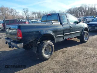 1997 Ford F-150 XL with VIN 1FTDX18W7VKC26527, listed as a IAAI auction lot 41692112 with 187,720 mi miles. Bid and sale history available at carsss.com. Image 4.