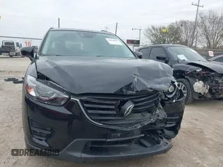 2016 Mazda CX-5 Grand Touring with VIN JM3KE2DY0G0651300, listed as a IAAI auction lot 41678833 with 98,790 mi miles. Bid and sale history available at carsss.com. Image 12.