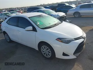 2019 Toyota Corolla L z VIN 5YFBURHEXKP877203, wystawiony jako IAAI lot #41893952 z przebiegiem 61 965 mil mil oraz . Historia ofert i sprzedaży dostępna na DreamBid. Obrazek 1.