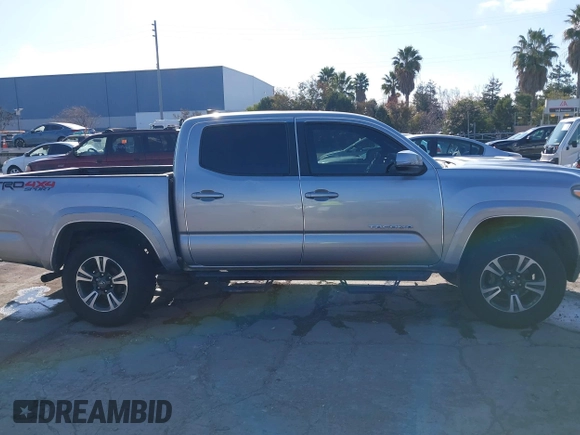 2018 Toyota Tacoma SR with VIN 3TMCZ5AN6JM185891, listed as a IAAI auction lot 41450665 with 53,749 mi miles and . Bid and sale history available at DreamBid. Image 14.