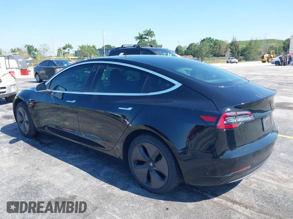 2019 Tesla Model 3 Mid Range with VIN 5YJ3E1EA0KF317058, listed as a IAAI auction lot 42025195 with 108,771 mi miles. Bid and sale history available at carsss.com. Image 3.