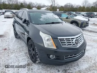2015 Cadillac SRX Premium Collection z VIN 3GYFNGE34FS627609, wystawiony jako IAAI lot #41604819 z przebiegiem 96 531 mil mil oraz . Historia ofert i sprzedaży dostępna na DreamBid. Obrazek 1.
