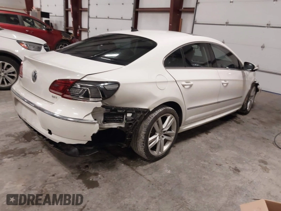 2014 Volkswagen CC Lux with VIN WVWRP7AN9EE519502, listed as a IAAI auction lot 41458158 with 85,988 mi miles. Bid and sale history available at carsss.com. Image 4.