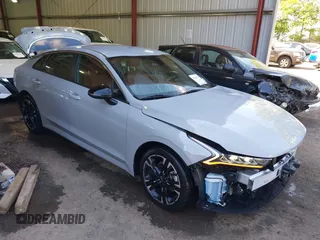 2023 Kia K5 GT-Line z VIN 5XXG64J25PG178807, wystawiony jako IAAI lot #42288788 z przebiegiem 27 250 mil mil oraz . Historia ofert i sprzedaży dostępna na DreamBid. Obrazek 1.