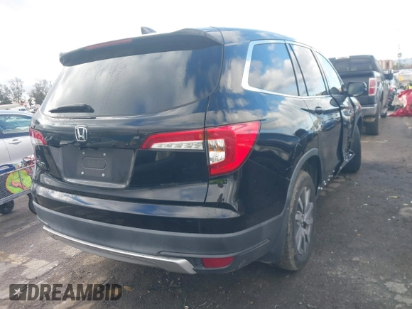 2019 Honda Pilot EX-L with VIN 5FNYF5H51KB013763, listed as a IAAI auction lot 41711089 with 79,651 mi miles and . Bid and sale history available at DreamBid. Image 4.