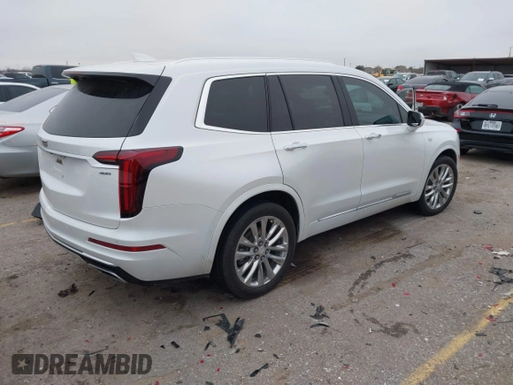 2021 Cadillac XT6 Premium Luxury z VIN 1GYKPCRSXMZ169206, wystawiony jako IAAI lot #41581841 z przebiegiem 64 789 mil mil oraz . Historia ofert i sprzedaży dostępna na DreamBid. Obrazek 4.