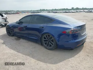 2021 Tesla Model S Plaid with VIN 5YJSA1E64MF442036, listed as a IAAI auction lot 42141304 with 24,998 mi miles and . Bid and sale history available at DreamBid. Image 3.