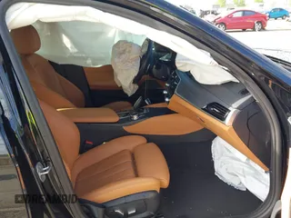 2023 BMW 5 Series 530e with VIN WBA13AG09PCL56556, listed as a IAAI auction lot 42098427 with Not provided miles and . Bid and sale history available at DreamBid. Image 5.