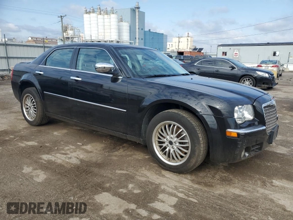 2009 Chrysler 300 with VIN 2C3LK33V19H614083, listed as a Copart auction lot 77529014 with 188,125 mi miles and Salvage title. Bid and sale history available at DreamBid. Image 4.