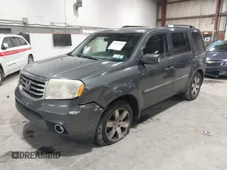 2012 Honda Pilot Touring with VIN 5FNYF4H99CB052034, listed as a IAAI auction lot 42023430 with 137,428 mi miles. Bid and sale history available at carsss.com. Image 2.