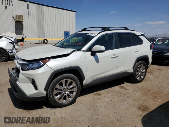 2021 Toyota RAV4 XLE Premium with VIN 2T3C1RFV0MW153089, listed as a Copart auction lot 60759615 with 28,153 mi miles and Salvage title. Bid and sale history available at DreamBid. Image 1.