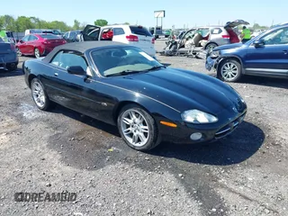 2002 Jaguar XK with VIN SAJDA42C12NA30499, listed as a IAAI auction lot 41954577 with 77,152 mi miles and . Bid and sale history available at DreamBid. Image 1.