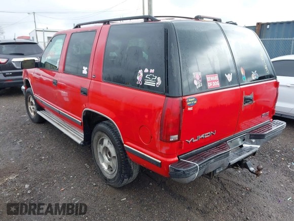 1998 GMC Yukon with VIN 1GKEK13R0WJ703105, listed as a IAAI auction lot 41980869 with 302,546 mi miles. Bid and sale history available at carsss.com. Image 3.