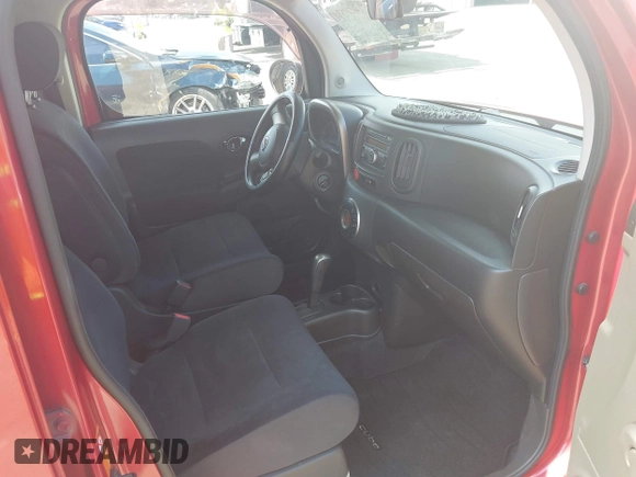 2009 Nissan Cube S z VIN JN8AZ28RX9T117772, wystawiony jako IAAI lot #42310747 z przebiegiem 147 582 mil mil oraz . Historia ofert i sprzedaży dostępna na DreamBid. Obrazek 5.