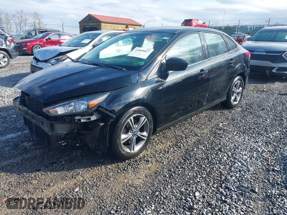 2018 Ford Focus SE z VIN 1FADP3FE9JL255818, wystawiony jako IAAI lot #42009017 z przebiegiem 79 329 mil mil oraz . Historia ofert i sprzedaży dostępna na DreamBid. Obrazek 18.