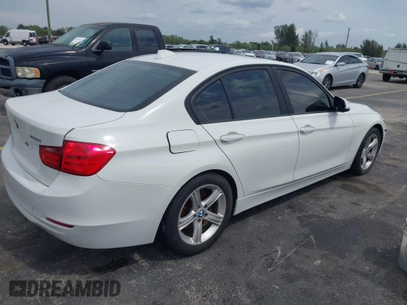 2013 BMW 3 Series 328i with VIN WBA3A5G51DNP26142, listed as a IAAI auction lot 41767977 with 129,440 mi miles. Bid and sale history available at carsss.com. Image 4.