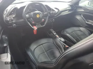 2016 Ferrari 488 z VIN ZFF79ALAXG0216223, wystawiony jako Copart lot #74210804 z przebiegiem Nie podano mil oraz Szkody całkowita. Historia ofert i sprzedaży dostępna na DreamBid. Obrazek 8.