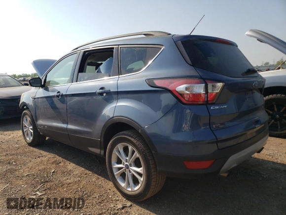 2018 Ford Escape SE z VIN 1FMCU9GD3JUA98865, wystawiony jako Copart lot #56842065 z przebiegiem 112 439 mil mil oraz Szkoda całkowita • Salvage title. Historia ofert i sprzedaży dostępna na DreamBid. Obrazek 2.