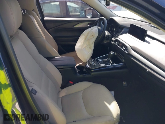 2021 Mazda CX-9 Touring with VIN JM3TCACY9M0526880, listed as a IAAI auction lot 42310923 with 25,991 mi miles and . Bid and sale history available at DreamBid. Image 5.
