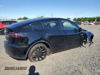 2023 Tesla Model Y Long Range z VIN 7SAYGDEE1PF865195, wystawiony jako Copart lot #57455765 z przebiegiem 32 011 mil mil oraz Szkoda całkowita • Salvage title. Historia ofert i sprzedaży dostępna na DreamBid. Obrazek 3.