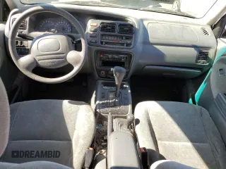 2000 Suzuki Vitara JX z VIN 2S3TD52V1Y6108459, wystawiony jako Copart lot #75526644 z przebiegiem 263 433 mil mil oraz Szkody całkowita. Historia ofert i sprzedaży dostępna na DreamBid. Obrazek 8.
