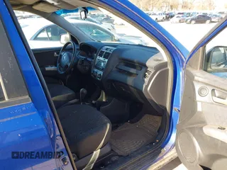2005 Kia Sportage LX with VIN KNDJF723157097517, listed as a IAAI auction lot 41485759 with 207,294 mi miles and . Bid and sale history available at carsss.com. Image 5.