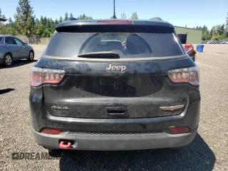 2017 Jeep Compass Trailhawk with VIN 3C4NJDDBXHT668053, listed as a Copart auction lot 63032155 with 94,090 mi miles and Salvage title. Bid and sale history available at DreamBid. Image 6.