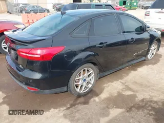 2015 Ford Focus SE with VIN 1FADP3F26FL356554, listed as a IAAI auction lot 41773139 with 143,911 mi miles. Bid and sale history available at carsss.com. Image 4.