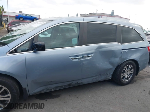 2012 Honda Odyssey EX-L with VIN 5FNRL5H60CB095086, listed as a IAAI auction lot 42251330 with 144,232 mi miles and . Bid and sale history available at DreamBid. Image 14.