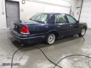 2000 Ford Crown Victoria with VIN 2FAFP73W1YX129365, listed as a IAAI auction lot 41865917 with 102,957 mi miles. Bid and sale history available at carsss.com. Image 4.