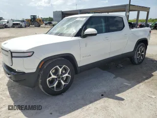 2023 Rivian R1T Adventure with VIN 7FCTGBAA5PN028668, listed as a Copart auction lot 61126184 with 2,337 mi miles and Salvage Title. Bid and sale history available at carsss.com. Image 1.