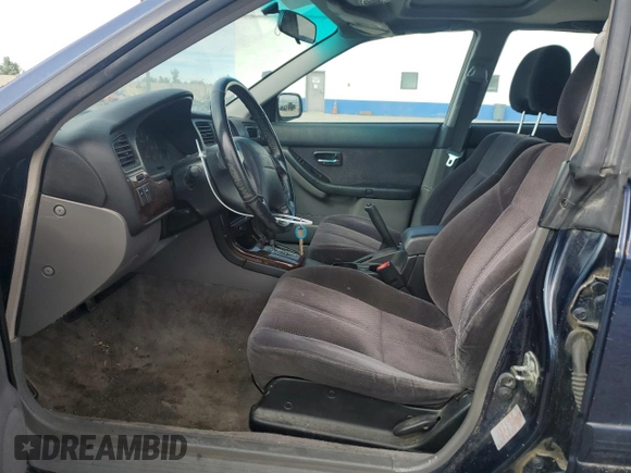 2003 Subaru Legacy L with VIN 4S3BE635337206073, listed as a Copart auction lot 54269664 with 206,230 mi miles and Salvage title. Bid and sale history available at DreamBid. Image 7.
