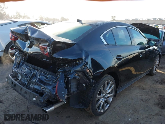 2020 Mazda 3 Premium with VIN 3MZBPAEM2LM124405, listed as a IAAI auction lot 41478818 with 72,551 mi miles and . Bid and sale history available at DreamBid. Image 4.