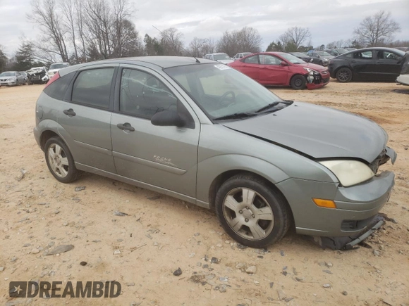 2006 Ford Focus S with VIN 1FAHP37N76W180039, listed as a Copart auction lot 58328565 with 220,696 mi miles and Salvage title. Bid and sale history available at DreamBid. Image 4.