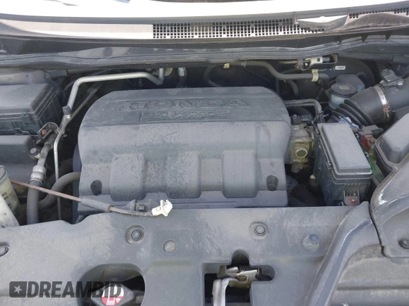 2014 Honda Odyssey Touring with VIN 5FNRL5H90EB082691, listed as a IAAI auction lot 42572977 with 54,413 mi miles and . Bid and sale history available at DreamBid. Image 10.