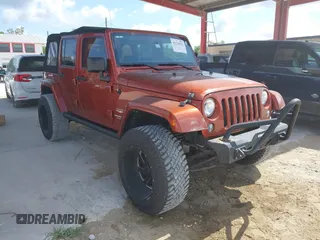 2014 Jeep Wrangler Unlimited Sahara z VIN 1C4BJWEG1EL209431, wystawiony jako IAAI lot #42325022 z przebiegiem 64 529 mil mil oraz . Historia ofert i sprzedaży dostępna na DreamBid. Obrazek 1.