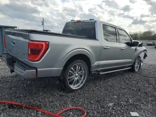 2023 Ford F-150 XL with VIN 1FTEW1C50PKF91124, listed as a Copart auction lot 51538865 with 22,128 mi miles and Salvage title. Bid and sale history available at DreamBid. Image 3.