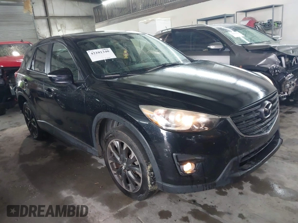 2016 Mazda CX-5 Grand Touring with VIN JM3KE4DY5G0816575, listed as a IAAI auction lot 42101340 with 180,762 mi miles and . Bid and sale history available at carsss.com. Image 1.