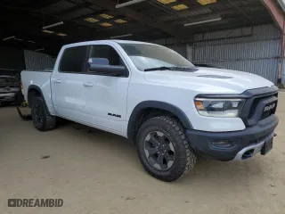2019 Ram 1500 Rebel with VIN 1C6SRFLTXKN618849, listed as a Copart auction lot 50419595 with 98,219 mi miles and Salvage Title. Bid and sale history available at carsss.com. Image 4.