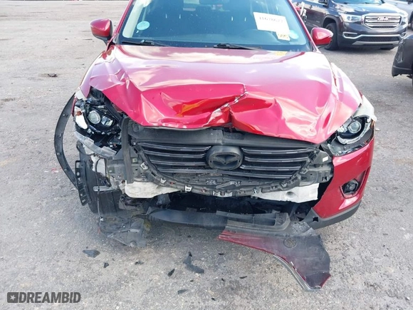 2016 Mazda CX-5 Touring with VIN JM3KE2CY8G0666550, listed as a IAAI auction lot 41678677 with NaN miles. Bid and sale history available at carsss.com. Image 6.