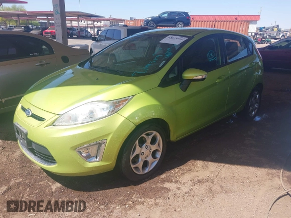 2011 Ford Fiesta SES with VIN 3FADP4FJ9BM119319, listed as a IAAI auction lot 42025691 with 104,516 mi miles. Bid and sale history available at carsss.com. Image 2.