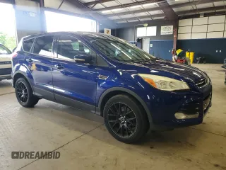2013 Ford Escape SEL z VIN 1FMCU9HX7DUC87287, wystawiony jako Copart lot #61798475 z przebiegiem 147 521 mil mil oraz Czysty tytuł • Clean title. Historia ofert i sprzedaży dostępna na DreamBid. Obrazek 4.