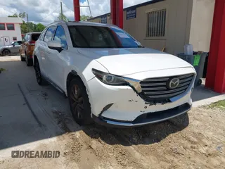 2016 Mazda CX-9 Grand Touring with VIN JM3TCADYXG0113563, listed as a IAAI auction lot 42593120 with 237,696 mi miles and . Bid and sale history available at DreamBid. Image 1.