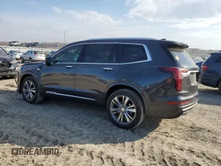 2021 Cadillac XT6 Premium Luxury z VIN 1GYKPCRS6MZ205831, wystawiony jako Copart lot #47259215 z przebiegiem 31 959 mil mil oraz Szkody całkowita. Historia ofert i sprzedaży dostępna na DreamBid. Obrazek 2.